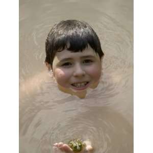  9 Year Old Boy Showing Off His Frog in a Pond, Woodstock 