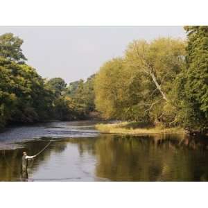 Salmon Fisherman Casting to a Fish on the River Dee, Wrexham, Wales 