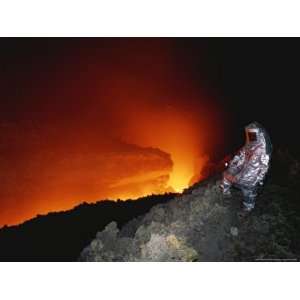  Scientist in Full Helmet and Thermal Suit Collects Lava 