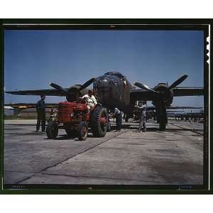   Incorporated being hauled along an outdoor assembly line Home