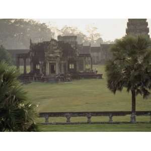  Tourists Visit the Ruins of the Angkor Wat Temple Amidst 