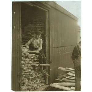  Photo Young boy working for Hickok Lumber Co. Location 