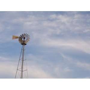 Windmill Stands Tall against a Cloudy Sky at Stevens Creek Farm 