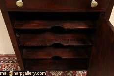Originally made about 1910 to hold sheet music, this cabinet has a 