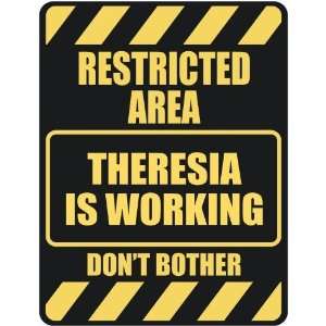   RESTRICTED AREA THERESIA IS WORKING  PARKING SIGN