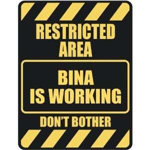   RESTRICTED AREA BINA IS WORKING  PARKING SIGN