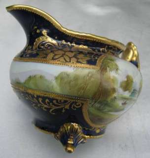 Antique Nippon Cobalt Creamer and Sugar with Man in Boat M in Wreath 