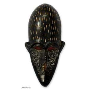  Senegalese wood mask, Never Be Cruel