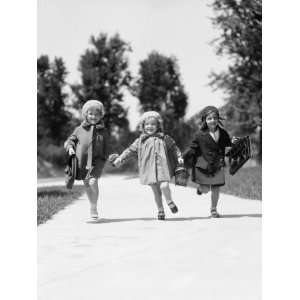  Three Girls Running Along Suburban Sidewalk, Carrying 