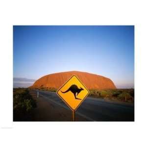   rock formation in the background, Ayers Rock  24 x 18  Poster Print