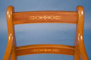   are inlaid with a satinwood design indicative of the Regency style