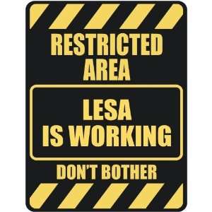   RESTRICTED AREA LESA IS WORKING  PARKING SIGN