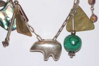 THIS AUCTION FEATURES A VINTAGE, ONE OF A KIND STERLING SILVER & CHARM 