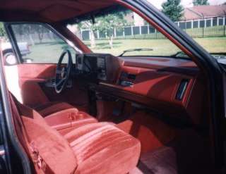 red cloth interior and high back reclining sport bucket seats with a 