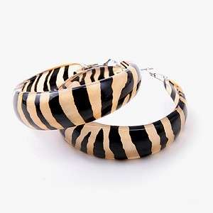 Cute Lucite Zebra print earrings.Dark Brown Brown and beige.Measures 2 