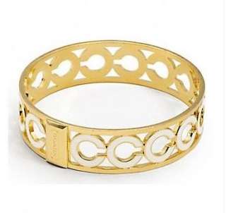 NEW AUTHENTIC GOLD COACH MEDIUM PIERCED OP ART BANGLE WITH WHITE 