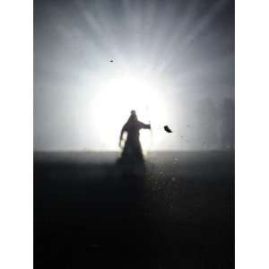  Performer Walks into Light During the Opening Ceremony for 