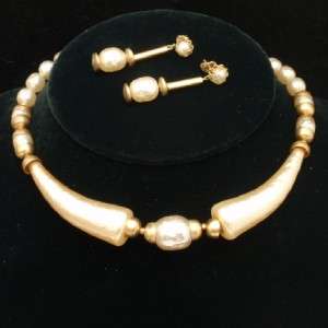 Faux pearls and goldtone fittings on memory wire for a dramatic choker 
