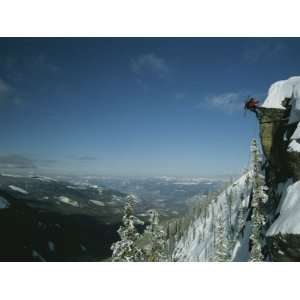  Rappeling with Snowboard, Red Mountain, British Columbia 